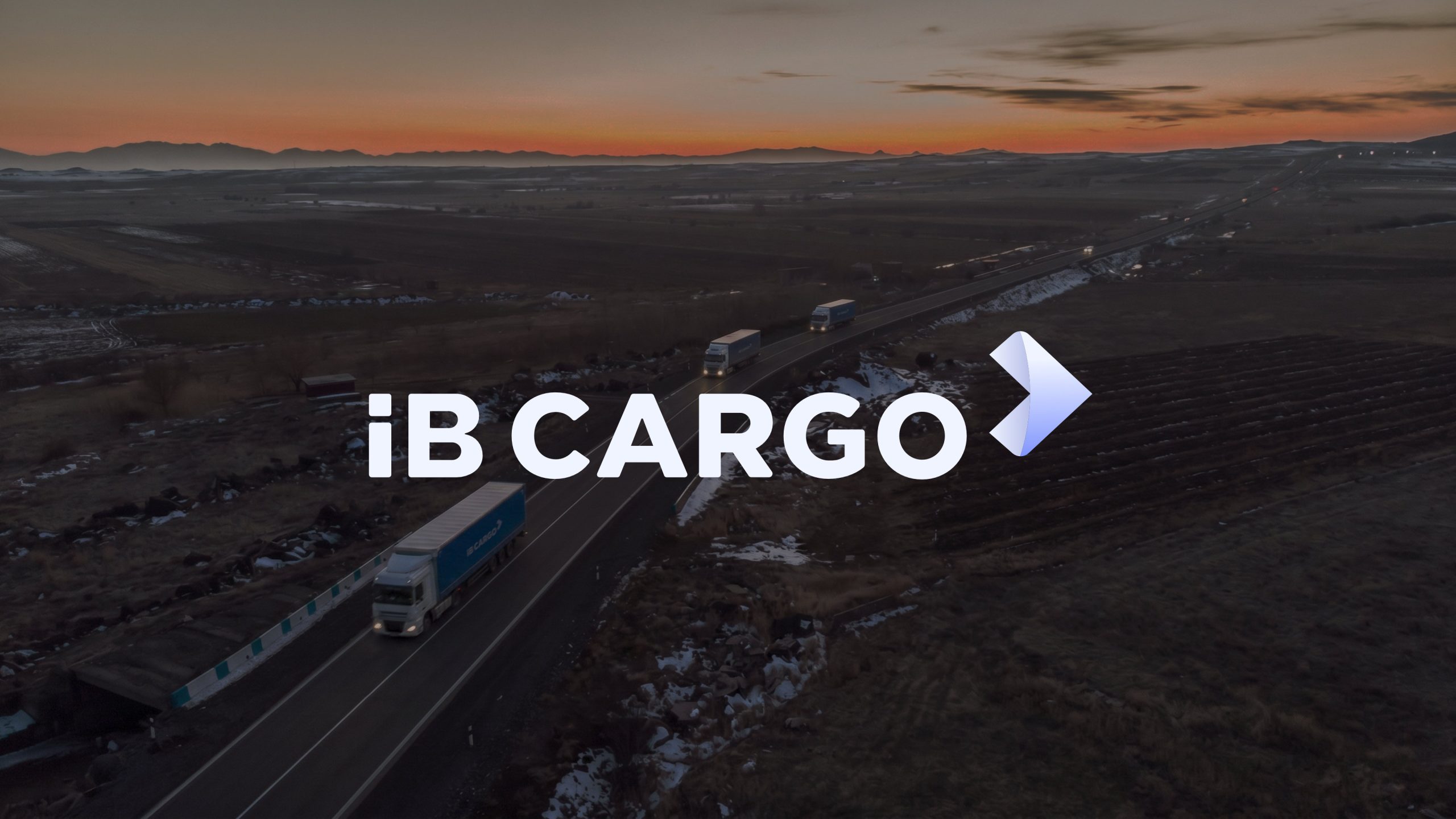 iB Cargo trucks on the road at dusk, freight brand identity in use